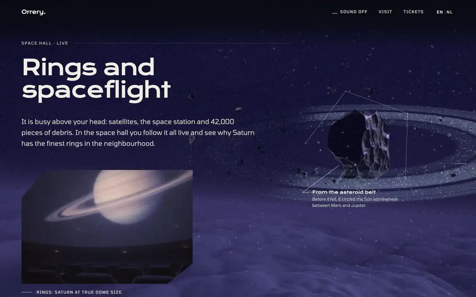 The Rings and spaceflight chapter: a meteorite inside a ring of debris, with a photo of Saturn in the dome hall